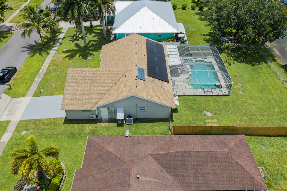 Aerial of pool home, listing photography